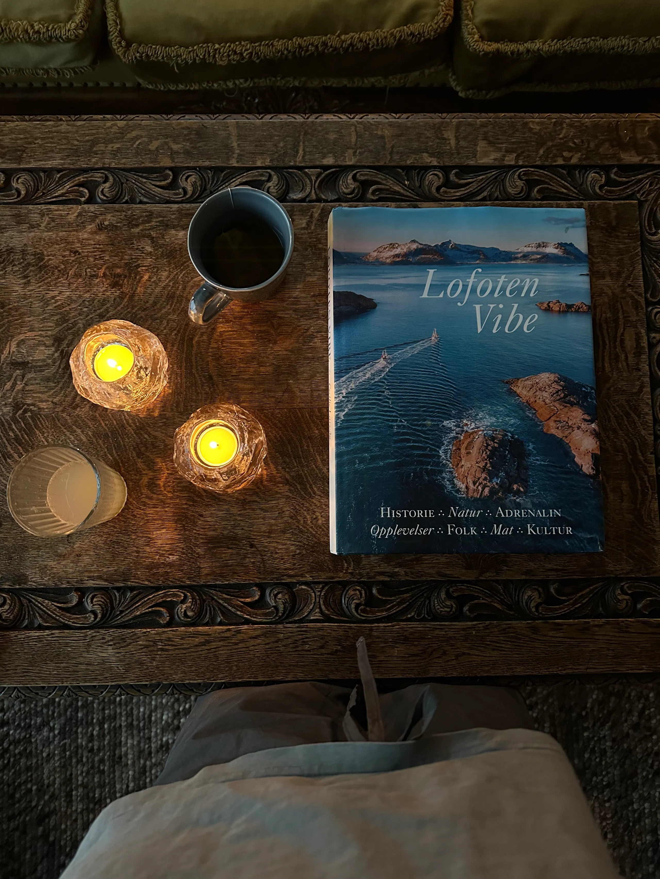 A Lofoten guidebook, candlelight and a quiet indoor moment from the trip