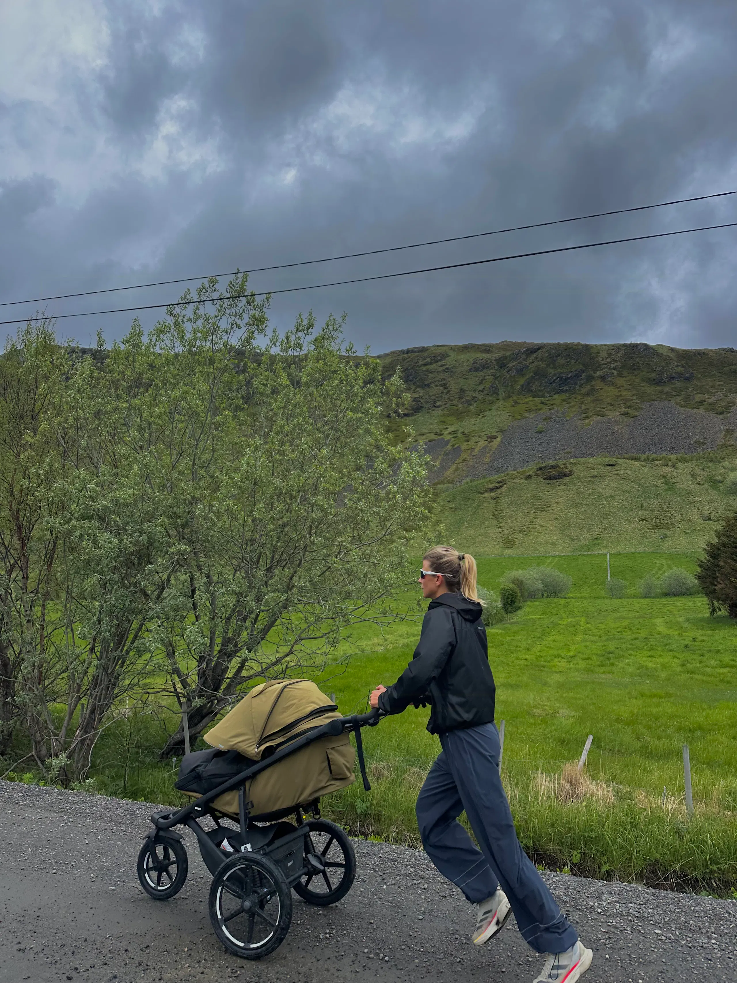 A walk with the stroller through green surroundings in Lofoten