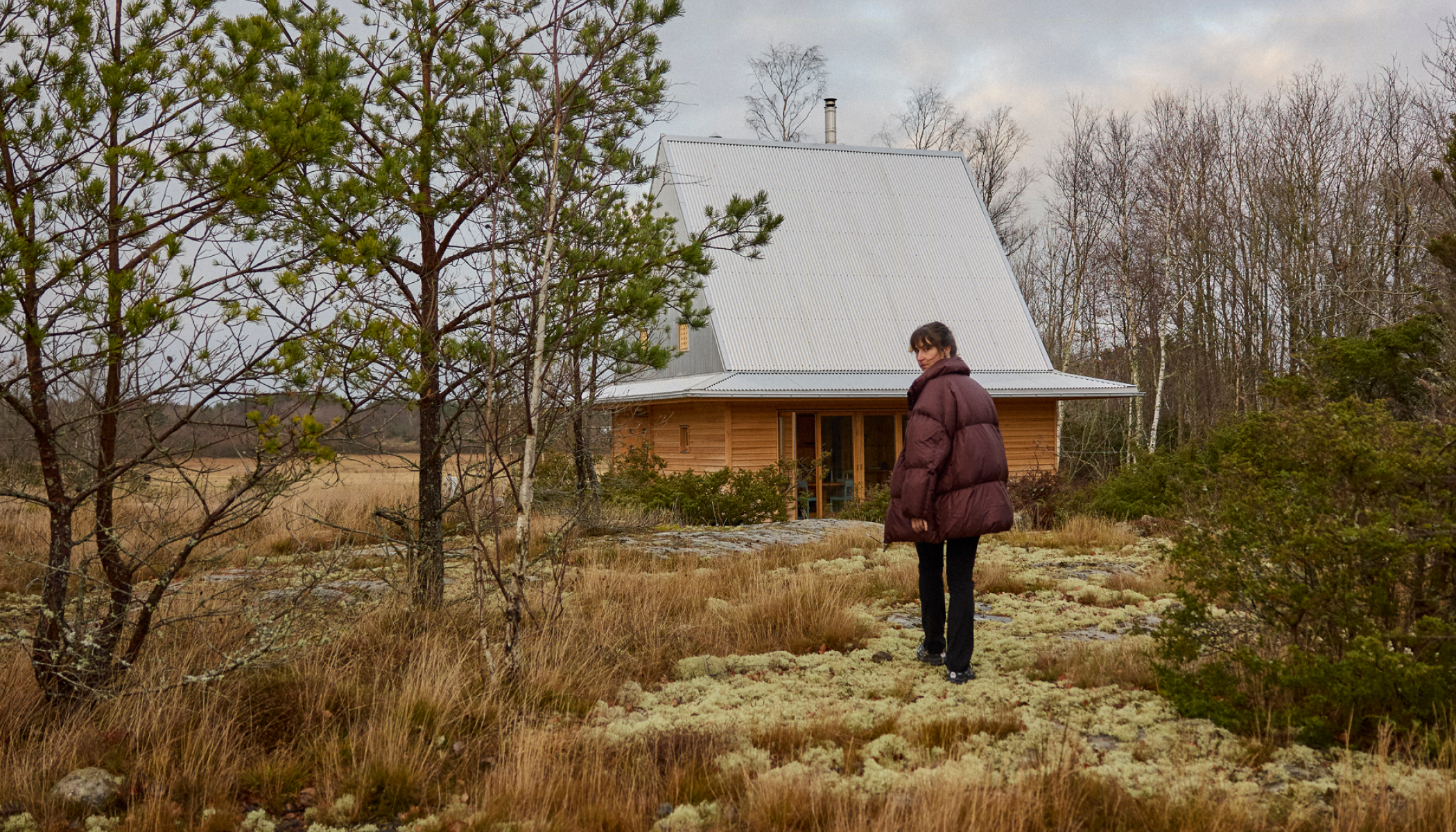 Linnea outside of cabin